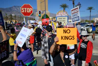 a group of people holding signs